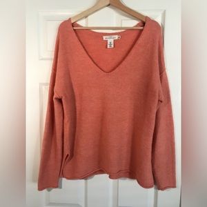 Divided peach sweater